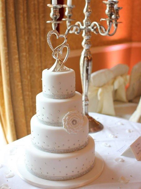 White Four Tier Wedding Cake With Diamond Details