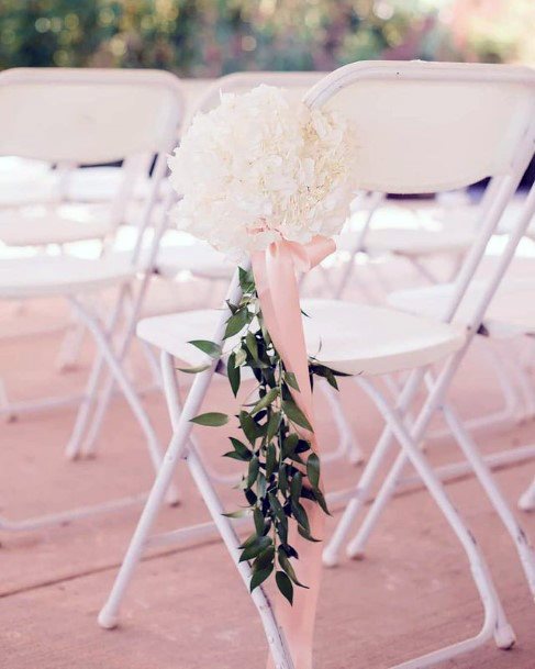 White Hydrangea Flowers On Chair