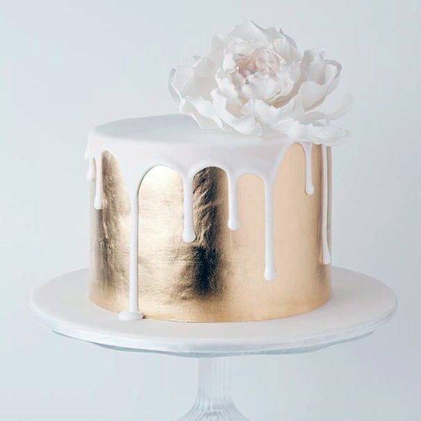 White Melting Icing On Gold Wedding Cake