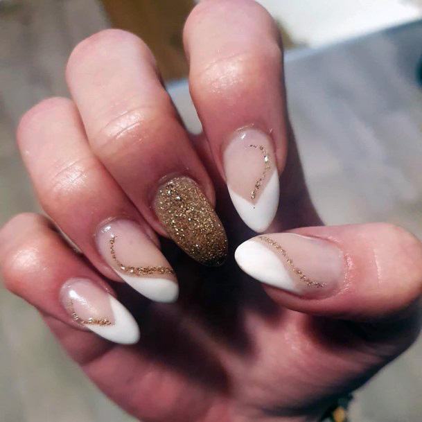 White Nails With Glittering Gold Spiral Design