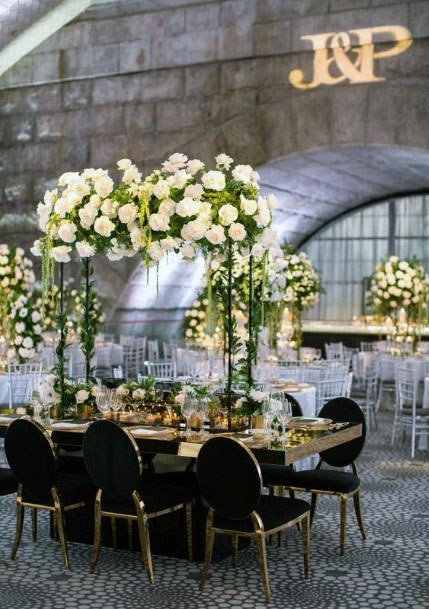 White Rose Arch And Black Chair Wedding Decor