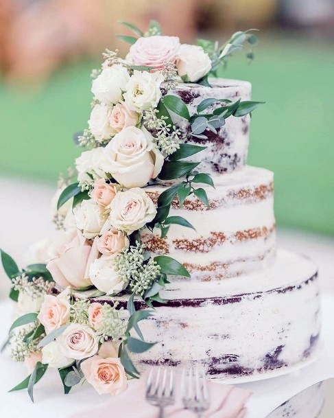 White Rose Garland On Rustic Wedding Cake