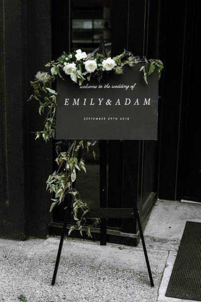 White Roses And Black Welcome Board Wedding Decor