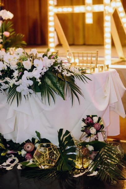 White Table Cloth And Hawaiian Wedding Flowers