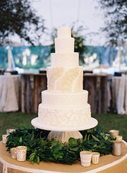 White Wedding Cake With Golden Accent Art