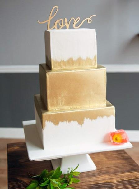 White Wedding Cake With Golden Spray Paint