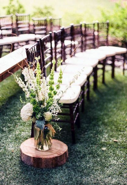 White Wedding Flowers In Aisle