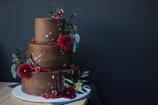 Wine Red Blossoms On Chocolate Wedding Cake