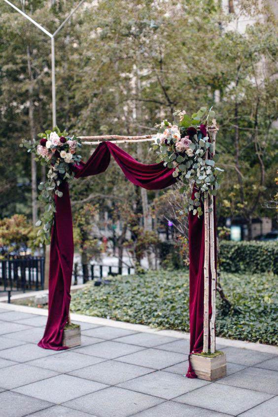 Wine Red Fabrics And Wedding Arch Flowers