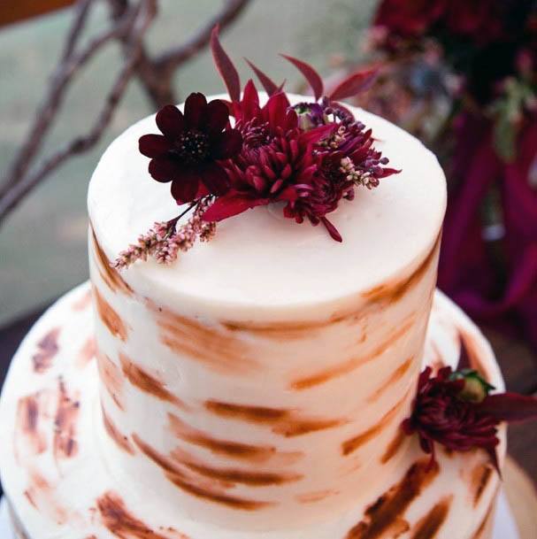 Wine Red Flowers And Golden Streaks Wedding Cake