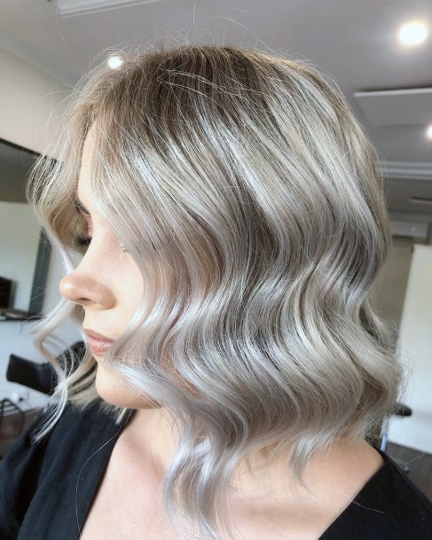 Woman Blonde Bob Hairstyle With Retro Loose Old Hollywood Waves