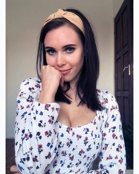 Woman In A Headband With A Dark Brown Lob Straight Hair