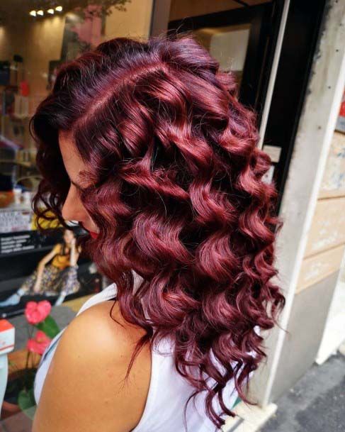 Woman With Beautiful Large Curls Throughout Dark Mahogany Brown