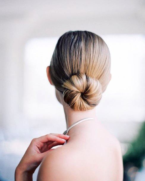 Woman With Beautiful Low Smooth Pulled Back Bun