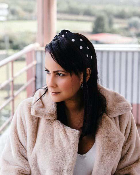 Woman With Black Hair And Long Side Bangs And Black Hairband