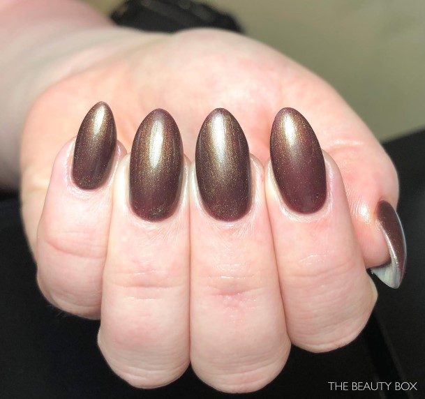 Woman With Chocolate Nail