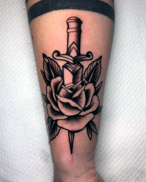 Woman With Dagger Rose Tattoo