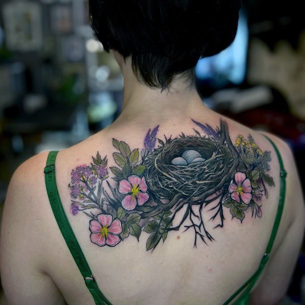 Woman With Fabulous Birds Nest Tattoo Design