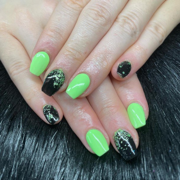 Woman With Fabulous Black And Green Nail Design