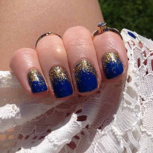 Woman With Fabulous Blue And Gold Nail Design