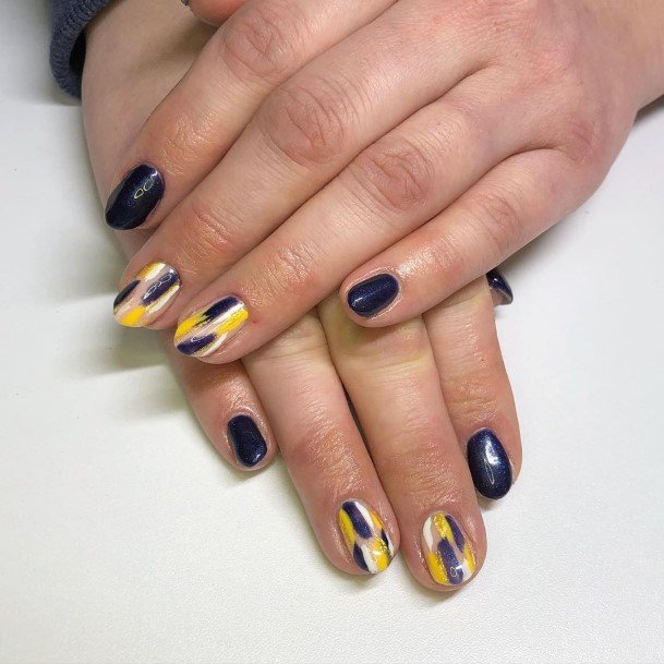 Woman With Fabulous Blue And Yellow Nail Design