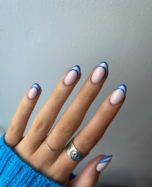 Woman With Fabulous Blue French Tip Nail Design