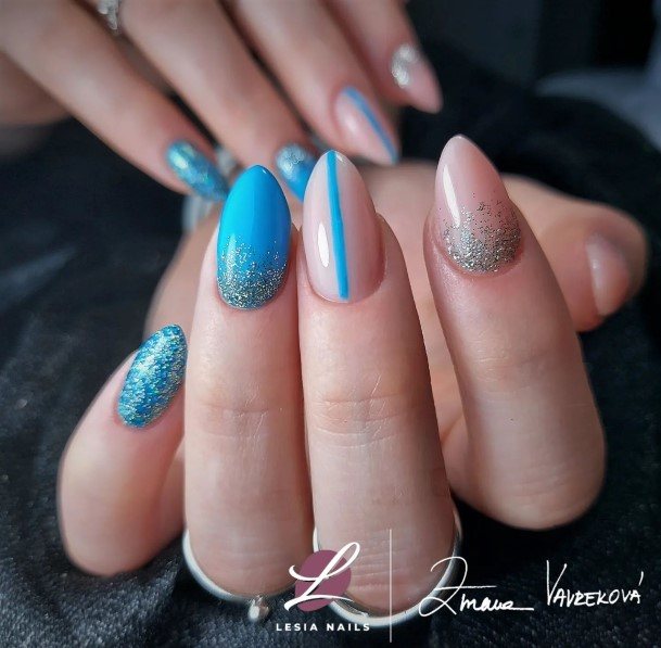 Woman With Fabulous Blue Glitter Nail Design