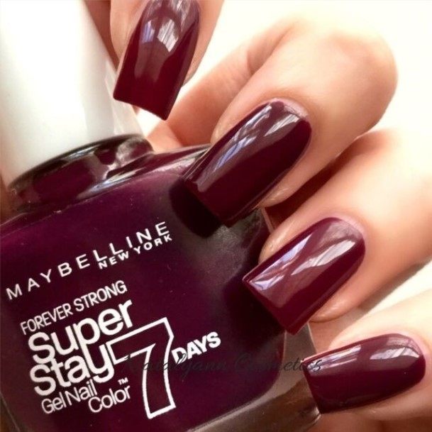 Woman With Fabulous Burgundy Nail Design