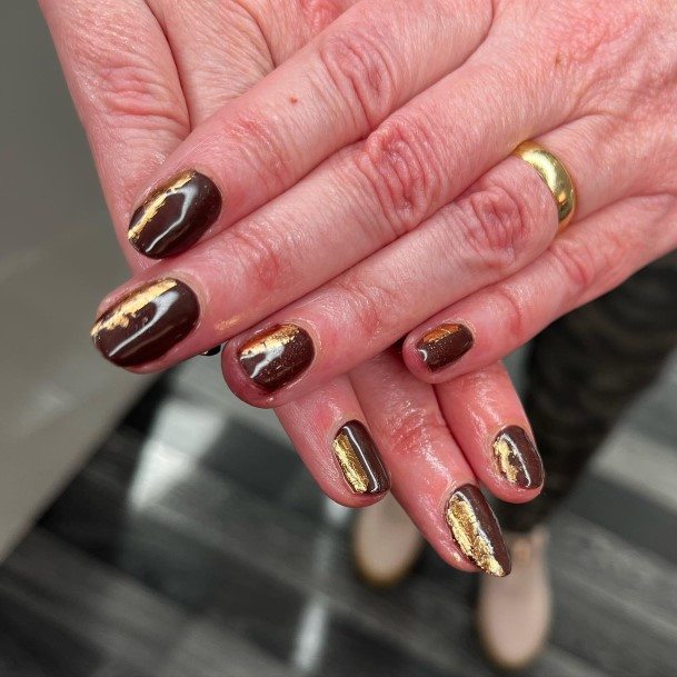 Woman With Fabulous Chocolate Nail Design