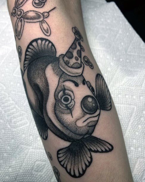 Woman With Fabulous Clown Fish Tattoo Design