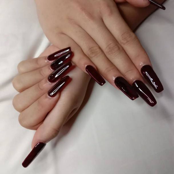 Woman With Fabulous Dark Maroon Nail Design