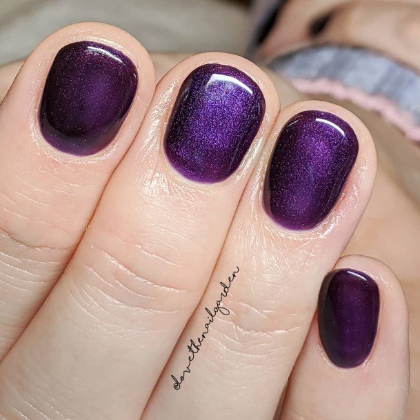 Woman With Fabulous Deep Purple Nail Design