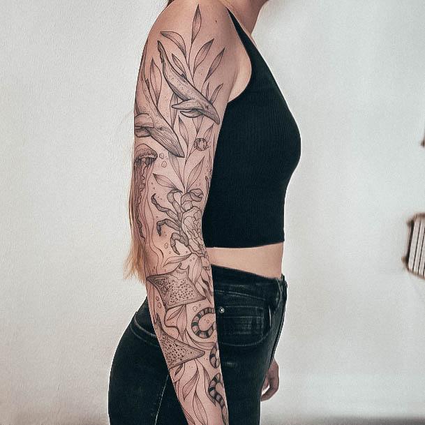 Woman With Fabulous Full Sleeve Tattoo Design