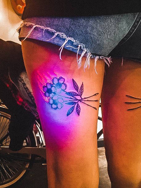 Woman With Fabulous Glow In The Dark Tattoo Design Thigh