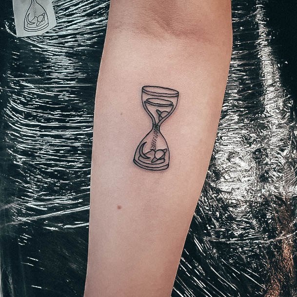 Woman With Fabulous Hourglass Tattoo Design
