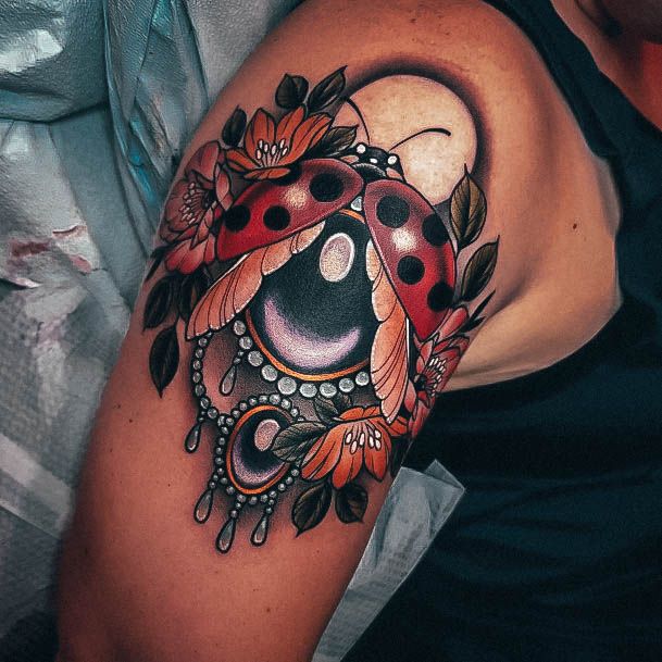 Woman With Fabulous Ladybug Tattoo Design