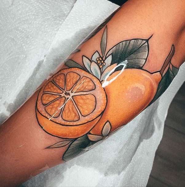 Woman With Fabulous Lemon Tattoo Design