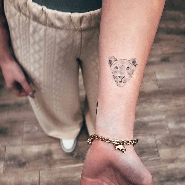 Woman With Fabulous Lioness Tattoo Design