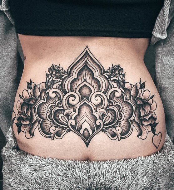 Woman With Fabulous Lower Back Tattoo Design