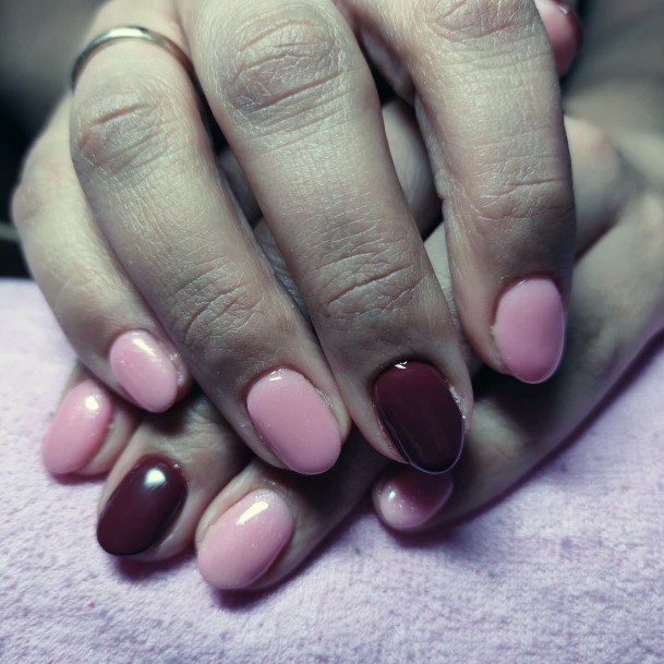 Woman With Fabulous Maroon And Pink Nail Design