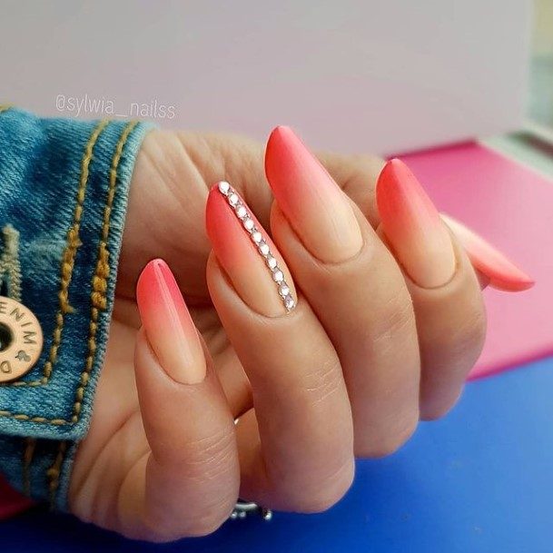 Woman With Fabulous Orange And White Nail Design