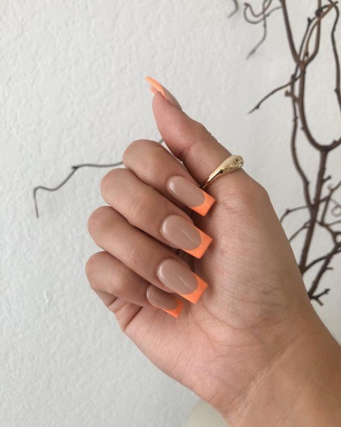 Woman With Fabulous Orange French Tip Nail Design