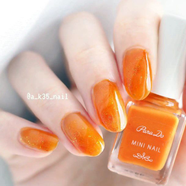 Woman With Fabulous Orange Nail Design