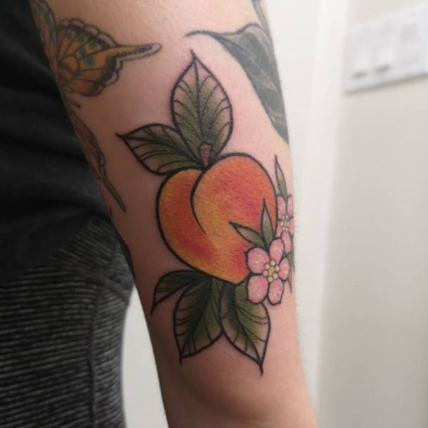 Woman With Fabulous Peach Tattoo Design