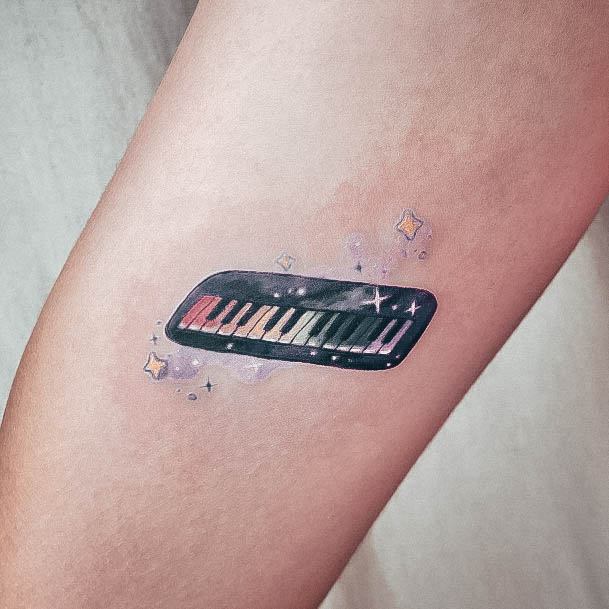 Woman With Fabulous Piano Tattoo Design