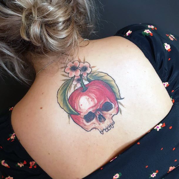 Woman With Fabulous Poison Apple Tattoo Design