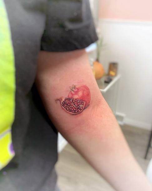 Woman With Fabulous Pomegranate Tattoo Design