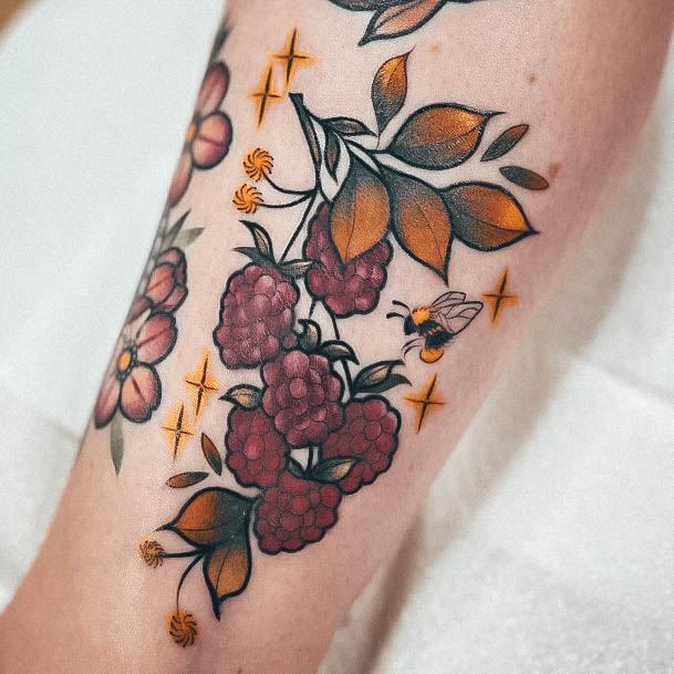 Woman With Fabulous Raspberry Tattoo Design