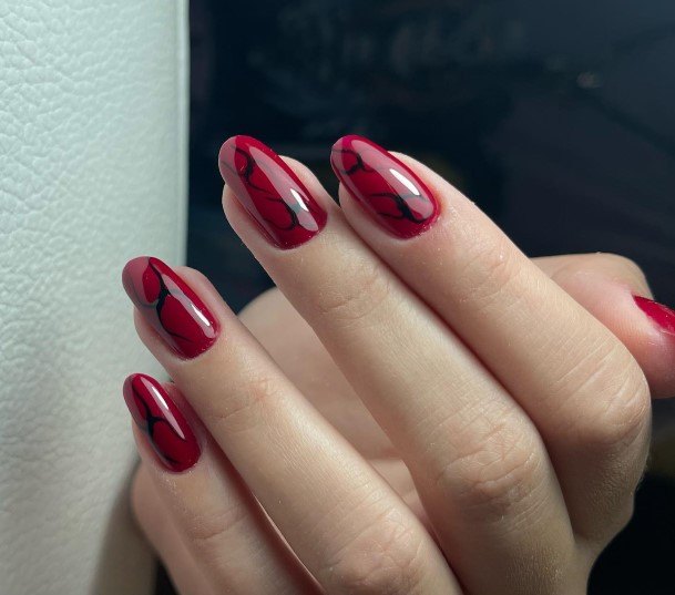 Woman With Fabulous Red And Black Nail Design