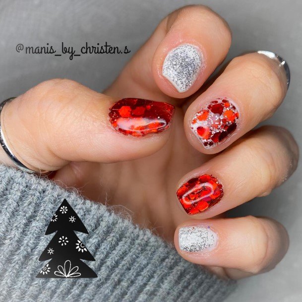 Woman With Fabulous Red And Silver Nail Design